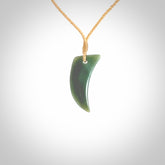 Hand carved pounamu drop pendant. Jade necklace hand made in New Zealand. A contemporary drop pendant carved from rare New Zealand Inanga jade. NZ Pacific jade jewellery for sale online.